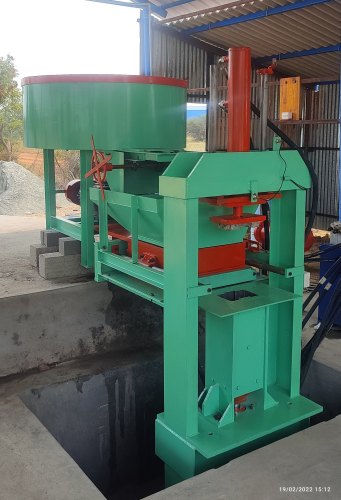 Interlocking brick making machine